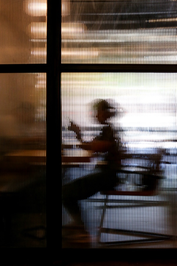 Research in progress behind textured glass